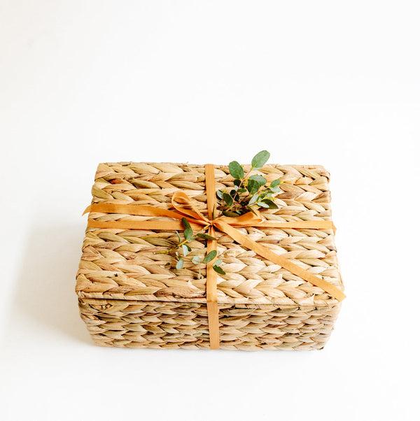 Water hyacinth gift basket with ribbon and eucalyptus leaves